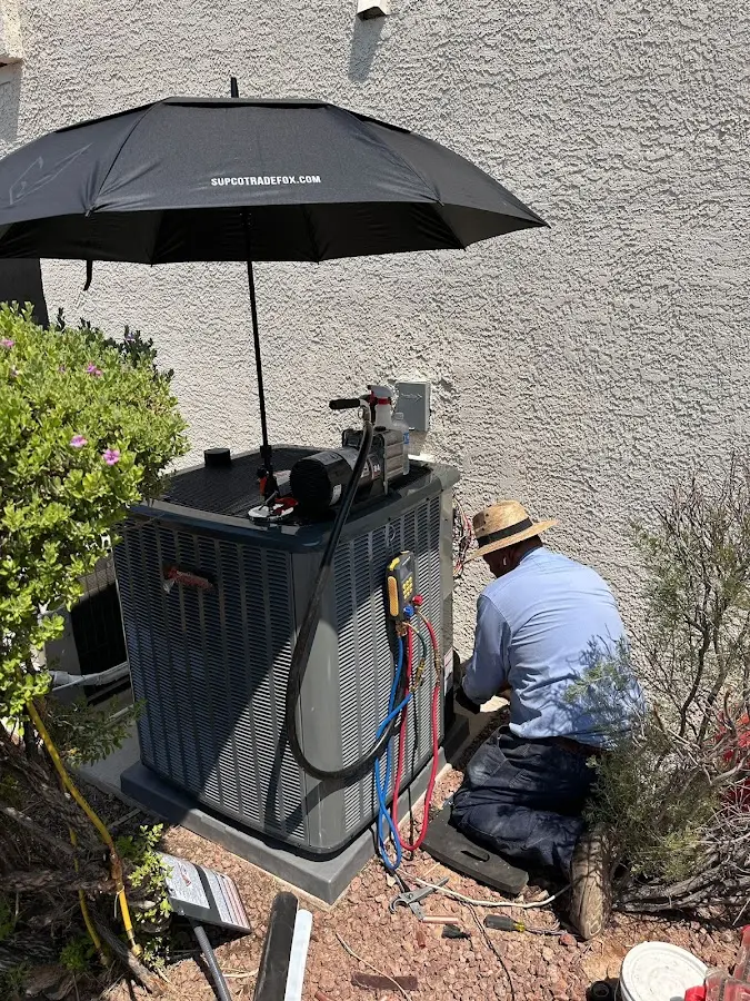 HVAC technician performing outdoor AC maintenance in Mount Dora