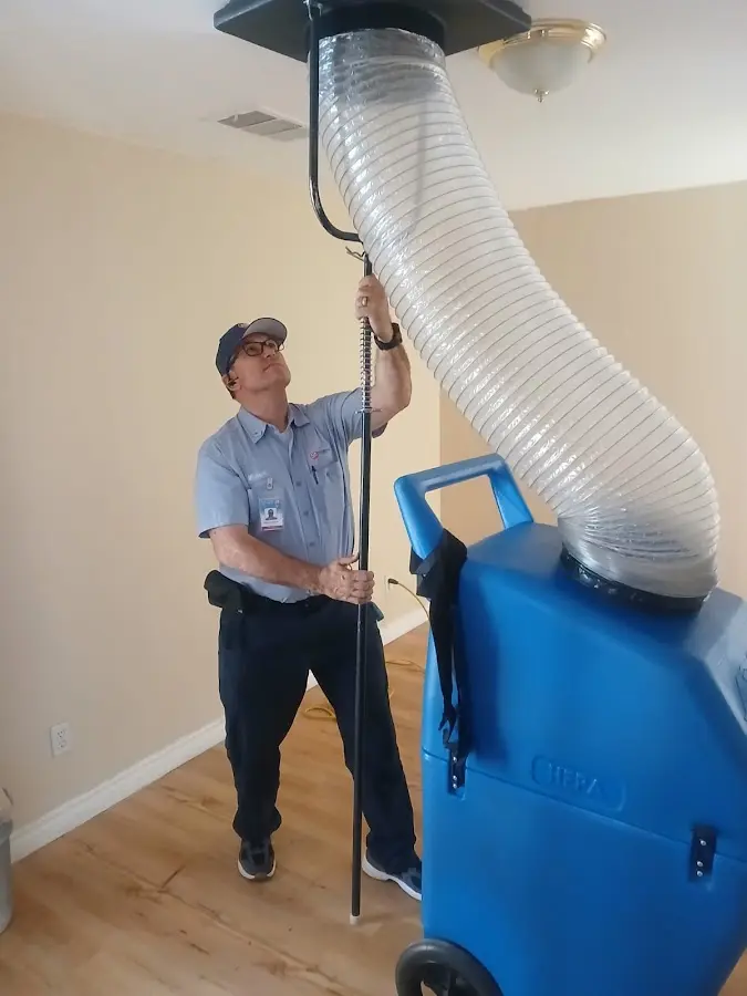Furnace Tune-Up technician using HEPA equipment in Mount Dora